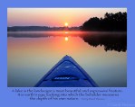 blue kayak perspective on lake with Henry David Thoreau quote